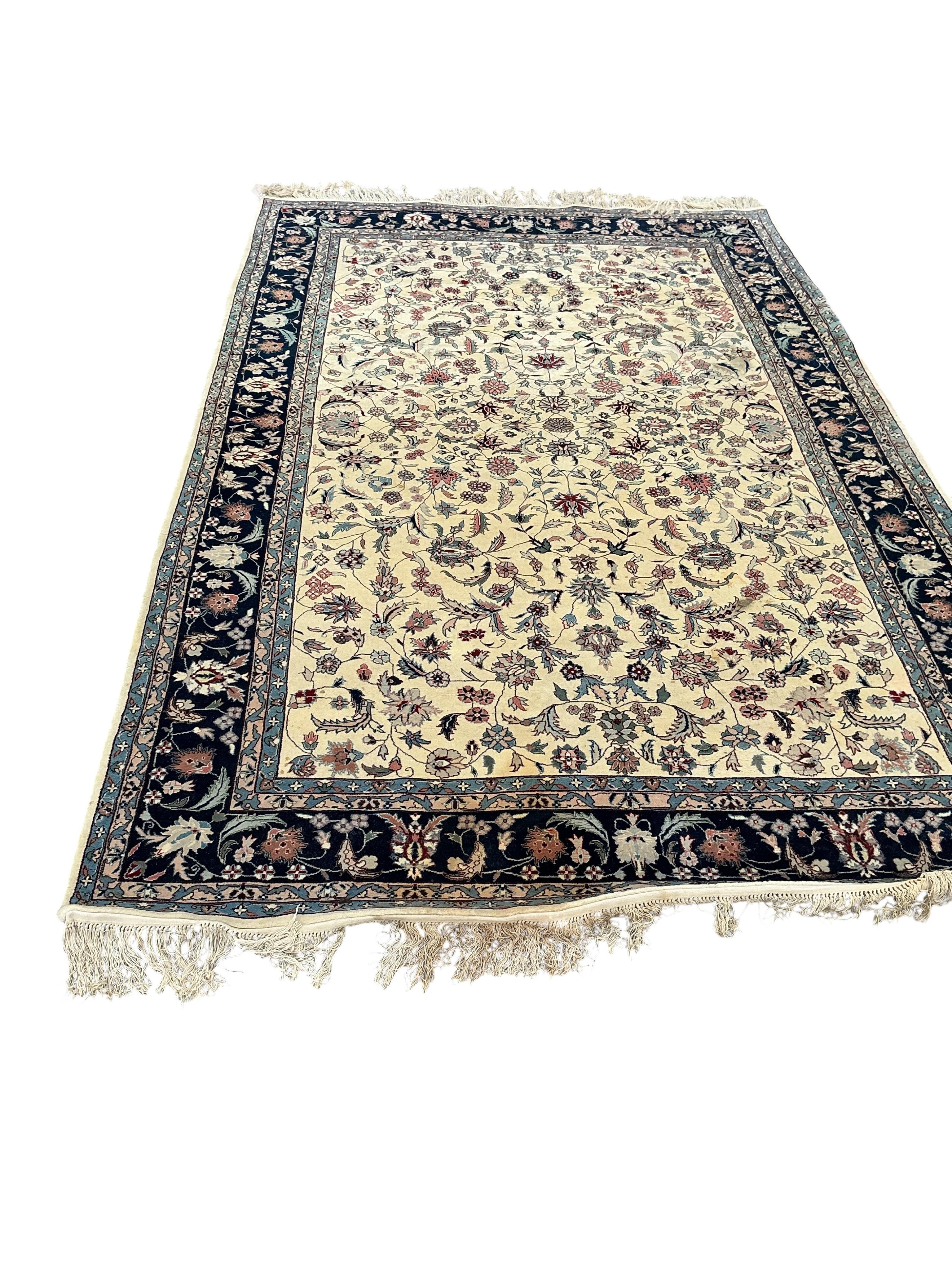 A Tabriz ivory ground floral rug, 240 x 150cm